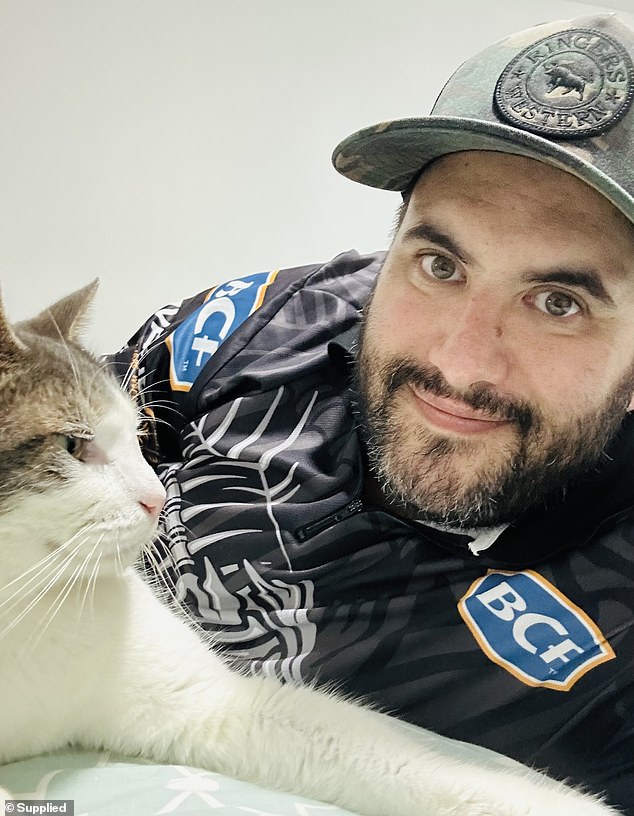 Wayne England (pictured with Ralph) and his wife Renee noticed their beloved cat was missing on May 10