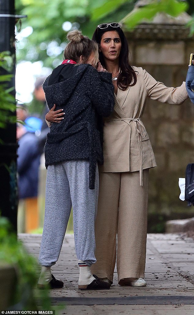 Actress Leila Farzad was also on set during filming and cut a chic figure in a cream beige suit