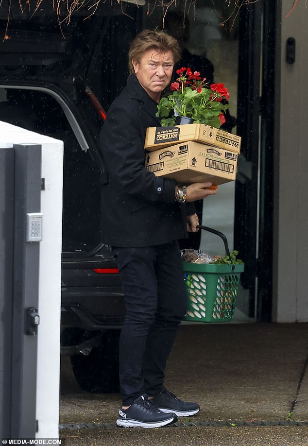 Richard Wilkins was spotted on Saturday using a Woolworths shopping basket to carry his groceries home after a day of shopping with his girlfriend Mia Hawkswell