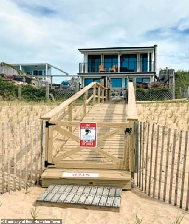 The city of East Hampton has destroyed the wooden structure that connected the $2 million home (pictured) at 88 South Emerson Avenue, owned by Roy Tuccillo Sr., to the beach