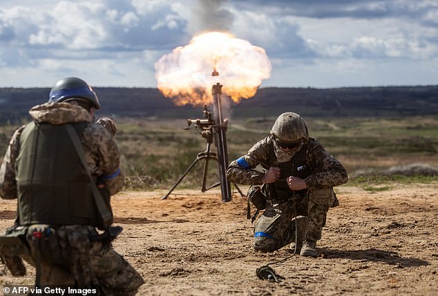 Ukrainian soldiers shoot mortars during military training with French soldiers in Poland, April 4, 2024