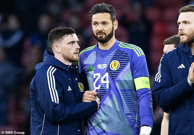 Scotland skipper Robertson consoles Craig Gordon at the end of what could be his final cap