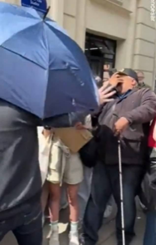 Sabrina Carpenter's bodyguard was accidentally hit in the face with an umbrella against a fan while pushing photographers out of the way as she arrived at London's BBC Radio 1 Studios on Tuesday.