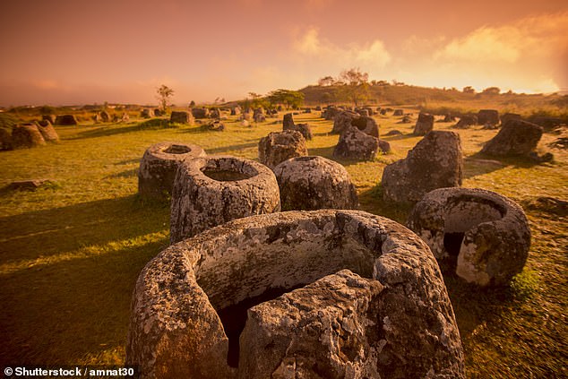 The Plain of Jars: Thousands of enormous stone jars spread across 90 sites near the town of Phonsavan.  Annabel says: 'It is one of the most spectacular archaeological sites in the world'