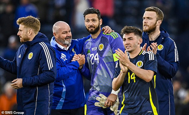 Clarke comforts Gordon after the draw at Hampden, having previously ended his Euro 2024 dream