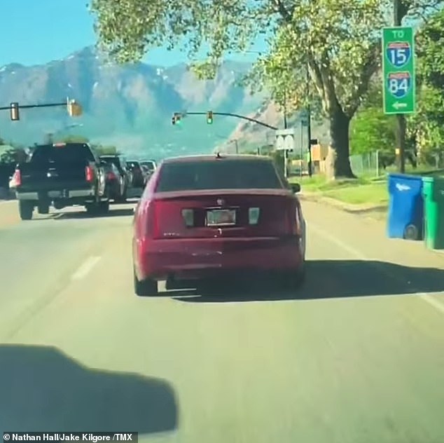 Dashboard camera footage captured a car slowly crossing multiple lanes and oncoming cars before hitting a house and a parked vehicle, sending a man to the hospital