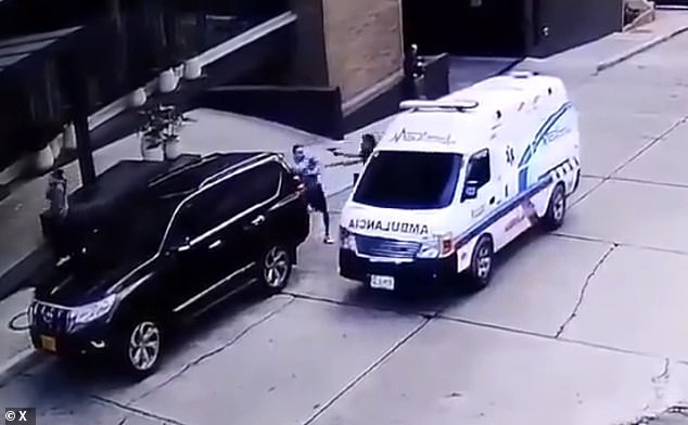 One of the kidnappers pointed his gun at the businessman moments before one of his accomplices helped him force the victim into the ambulance in Bogotá, Colombia, on Saturday.