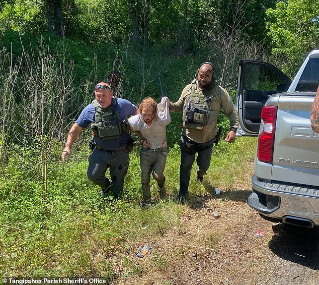 Footage taken by officers shows the disheveled Callihan being held up by two law enforcement officers as he was apprehended