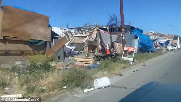 Michael Oxford, the host of CaliBased, posted a video on May 31 of massive temporary homes built along service roads that connect to major thoroughfares in California's newest Hooverville, Oakland.