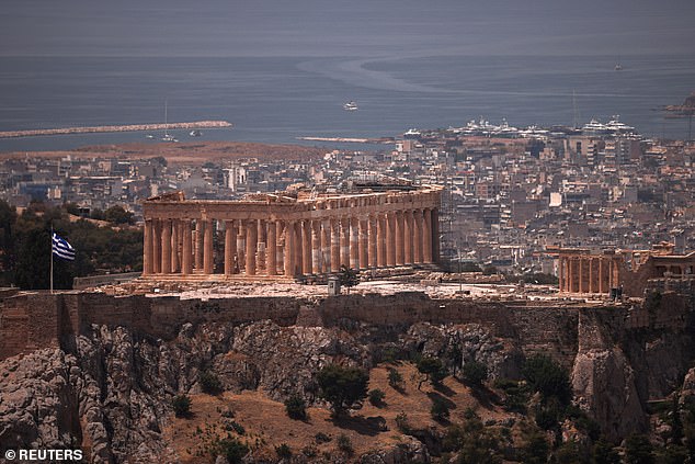 A view of the Parthenon Temple while the archaeological site on Acropolis Hill is closed to visitors due to a heat wave that hit Athens on June 12