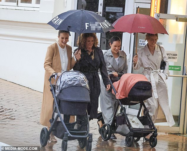 Simone Holtznagel was spotted making a bold statement as she ventured out into the rain for dinner with her sisters Madeline and Anna in Coogee