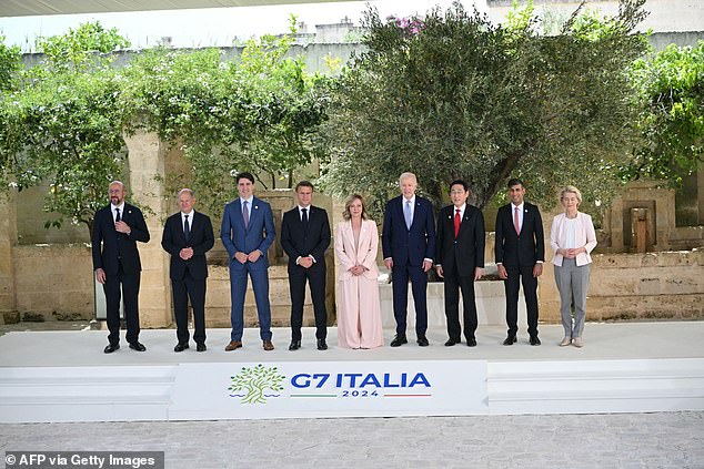 From left to right: European Council President Charles Michel, German Chancellor Olaf Scholz, Canadian Prime Minister Justin Trudeau, French President Emmanuel Macron, Italian Prime Minister Giorgia Meloni, US President Joe Biden, Japanese Prime Minister Fumio Kishida, British Prime Minister Rishi Sunak and European Commission President Ursula von der Leyen pose for a family photo at the G7