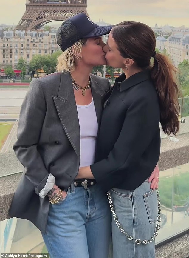 Sophia Bush shared passionate kisses with her girlfriend, athlete Ashlyn Harris, 38, while in France.  The video can be seen on her Insta stories as they look into each other's eyes and then kiss on the lips while the Eiffel Tower in Paris is behind them