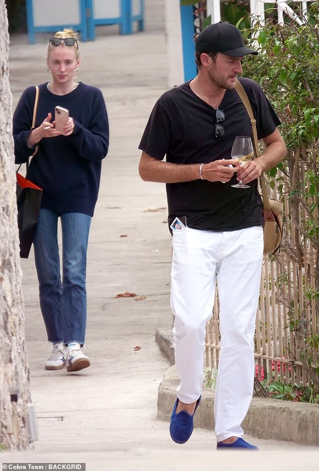 Sophie Turner showed off a gold ring on THAT finger as she hinted at engagement to boyfriend Peregrine Pearson during a romantic getaway in Capri, Italy on Saturday