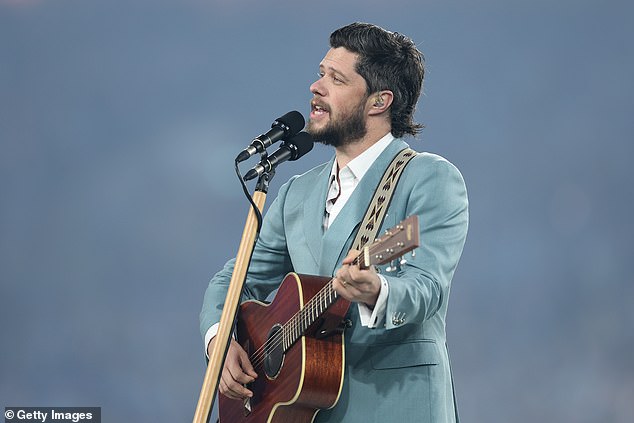 Ahead of Game One of the 2024 State of Origin, Australian Idol winner Dylan Wright gave a stripped-down rendition of Advance Australia Fair to a packed house at Sydney's Accor Stadium.  Pictured