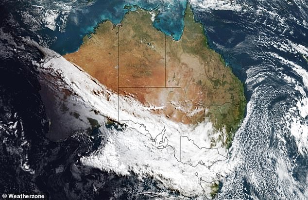 Weatherzone's Anthony Sharwood said a satellite image (pictured) over Australia shows 'two classic winter cloud patterns' signaling the weather ahead