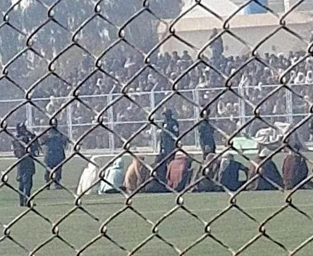 The Taliban brutally flogged nine men during a public show trial in a packed football stadium