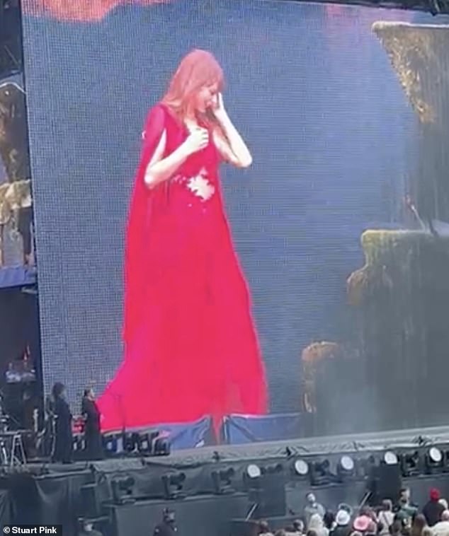 After performing the song, which she co-wrote with ex Joe on her 2020 album Evermore, the crowd chanted her name and Taylor removed her earpiece so she could fully appreciate the moment.