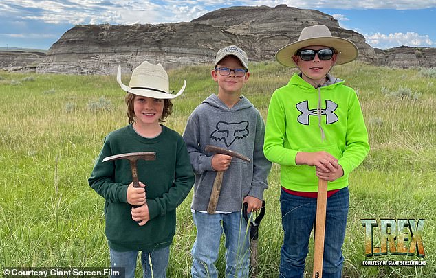 Liam Fisher (left), Kaiden Madsen (center), and Jessin Fisher (right) discovered an extremely rare teenage T-rex fossil in the Hell Creek badlands of North Dakota