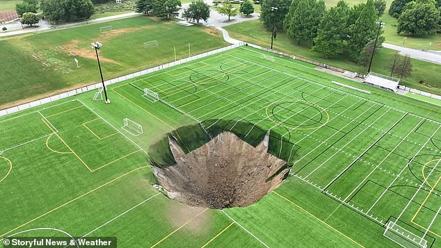 The sinkhole suddenly opened Wednesday morning at Gordon Moore Park in Alton, Illinois - no injuries were reported