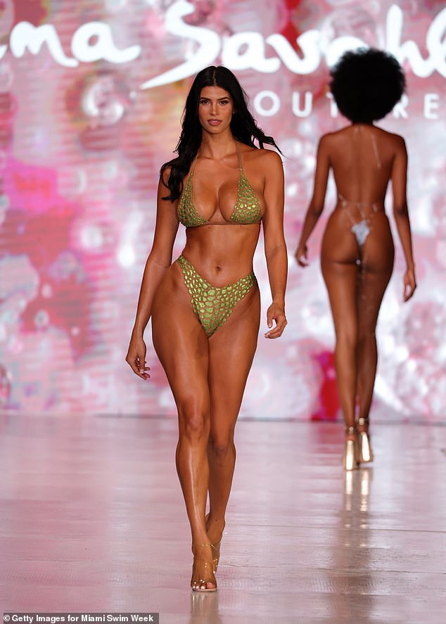 Travers 'The Candyman' Beynon's model daughter Lucciana, 22, (pictured) looked every bit the budding supermodel as she walked the runway for designer Ema Savahl at Miami Swim Week on Wednesday.