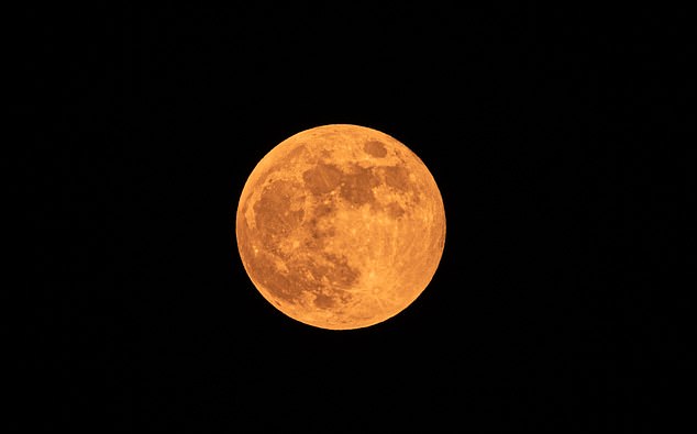 A beautiful Strawberry Moon will take on a golden hue on Friday as it fills the night sky, marking the first full moon of the summer season