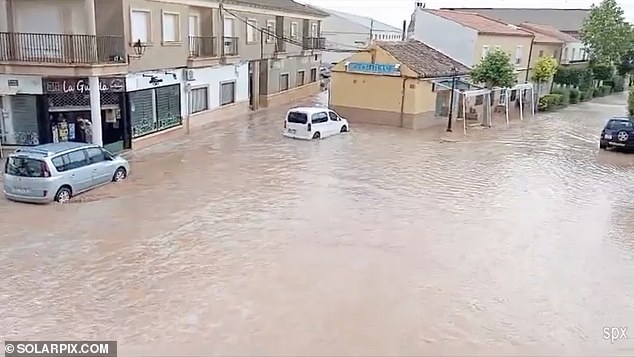 Images from the Costa Blanca showed submerged streets (pictured), flooding rivers and fast-flowing water flowing over dry fields before crashing onto highways