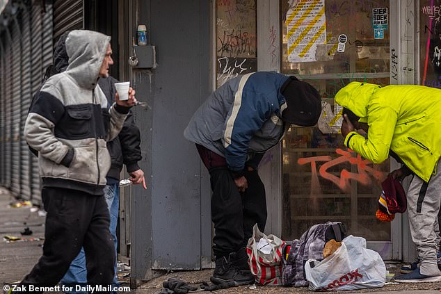 Drugs are openly used and distributed in Philadelphia's Kensington neighborhood, with many bent over in a trance-like state