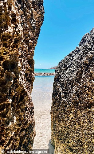 Upon arrival in Stokes Bay, visitors wander through a maze-like rock passage before emerging onto sun-drenched sand and water 'as clear as glass'.