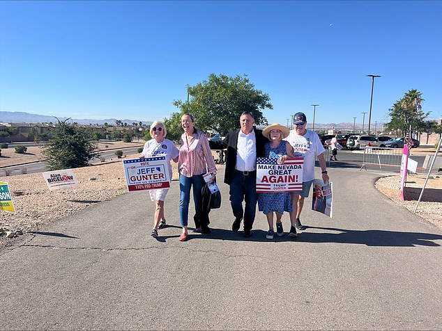 Dr.  Jeff Gunter (center) appears in Las Vegas to vote on Tuesday.  He is running against Sam Brown in the Nevada Senate primary