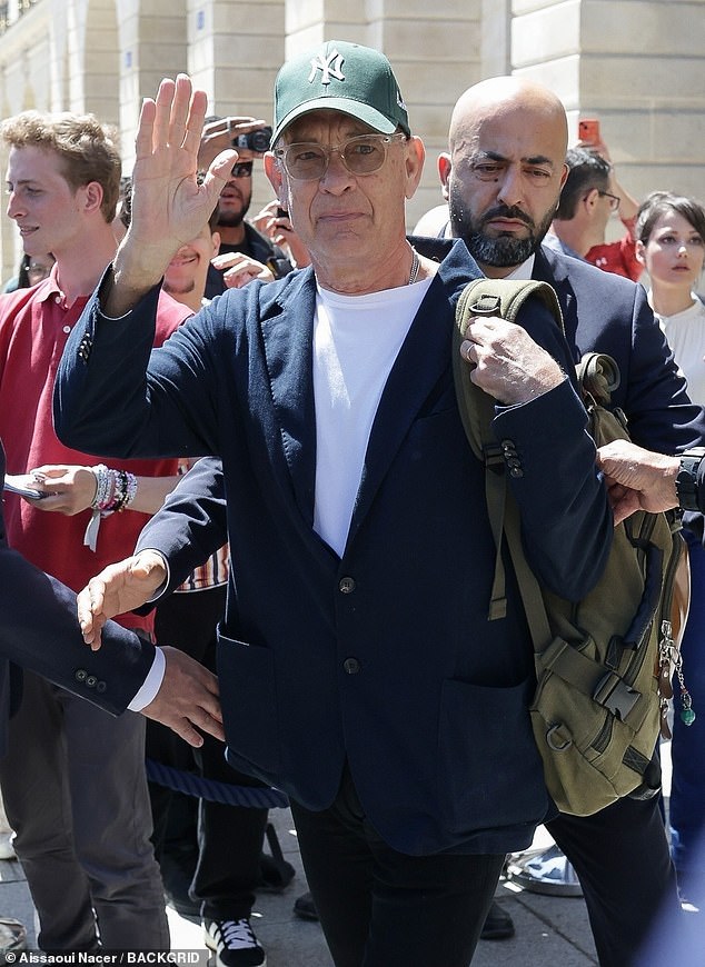 Tom Hanks and Steven Spielberg were in good spirits as they left the Ritz Hotel and into the Parisian sun on Friday.