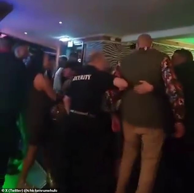 Tyson Fury (green jacket) had to be escorted out of a bar in Morecambe and later collapsed