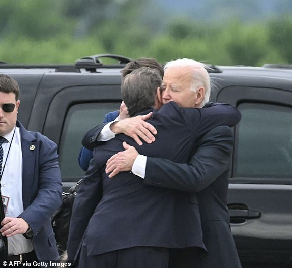 *** BESTPIX *** TOPSHOT - U.S. President Joe Biden hugs his son Hunter Biden upon arrival at the Delaware Air National Guard Base in New Castle, Delaware, on June 11, 2024, as he travels to Wilmington, Delaware.  A jury found Hunter Biden guilty of federal gun charges on June 11 in a historic first criminal prosecution of the child of a sitting US president.  President Joe Biden's 54-year-old son was convicted on all three federal charges he faced, CNN and other US media reported.  (Photo by ANDREW CABALLERO-REYNOLDS / AFP) (Photo by ANDREW CABALLERO-REYNOLDS/AFP via Getty Images)