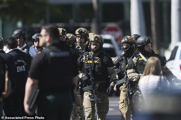 A large number of law enforcement officers swarmed the hostage situation at the Bank of America building at Bell Tower Shops in Fort Myers, Florida