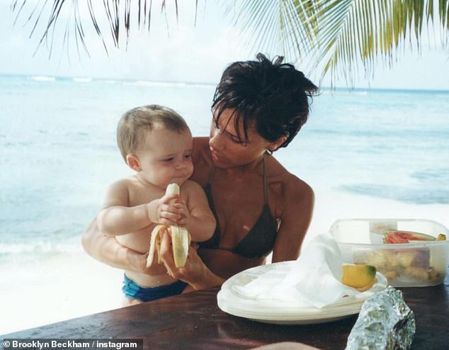 Victoria Beckham revealed she still has son Brooklyn's baby teeth after 20 years because she's 'sentimental' (pictured together in 1999)