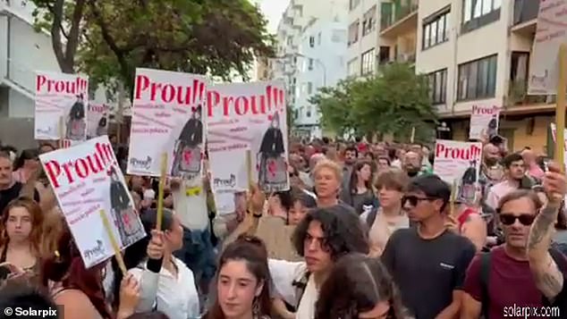 Protesters are seen marching through Ibiza calling on the local government to impose restrictions on mass tourism to the island