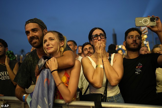 Despite the militant group's action, scores of Israelis were seen dancing and singing to music during the 'We Will Dance Again' concert