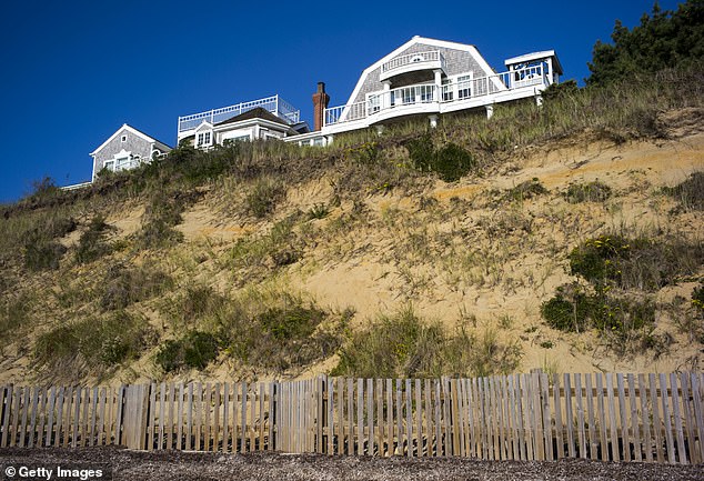 IN PHOTO: A house on Pocomo Beach on Nantucket Island, Massachusetts.  Several preventive methods are used to keep the seawall intact near expensive homes