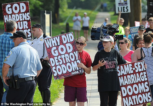 Evangelical leaders were among those least comfortable with same-sex marriage;  only seven percent responded that they agreed with the concept.  Pictured: Members of the Westboro Baptist Church protest in 2014