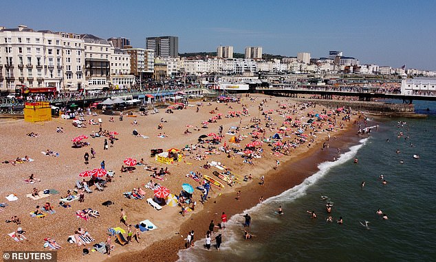 Stark contrast: June 2023 was the warmest June on record, the Met Office confirmed.  Pictured: Brighton Beach on June 25, 2023