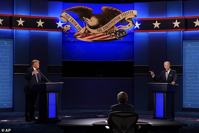 Former President Donald Trump, left, and Joe Biden, right, with moderator Chris Wallace, center, of Fox News during the first presidential debate on September 29, 2020