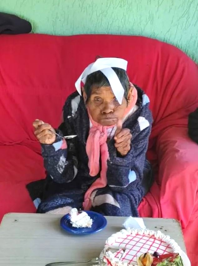 Pictured: Amantina dos Santos Duvirgem celebrates her 123rd birthday last year with a cake in Paraba Stae, Brazil, at a party organized by state government officials