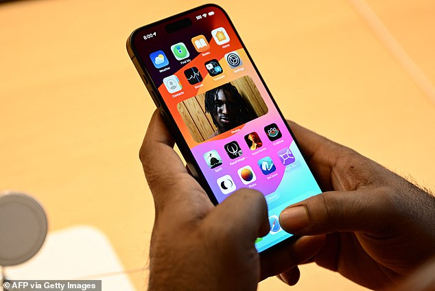 As of last year, Apple was effectively forced by the EU to put USB-C charging ports on iPhones.  A customer holds an iPhone 15 at a store in Los Angeles, California, on September 22, 2023, global release day