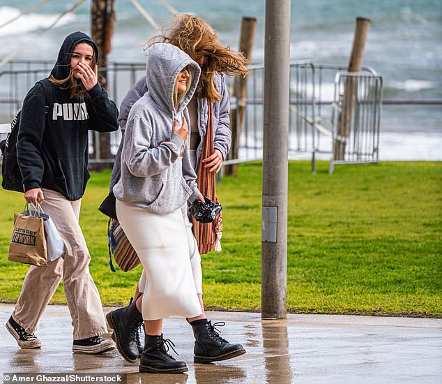 For parts of South Australia and Western Australia the high pressure system is likely to bring longer periods of rain than normal (Photo: People walking on Henley Beach, Adelaide)