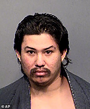 This undated booking photo provided by the Flagstaff Police Department shows Martinez