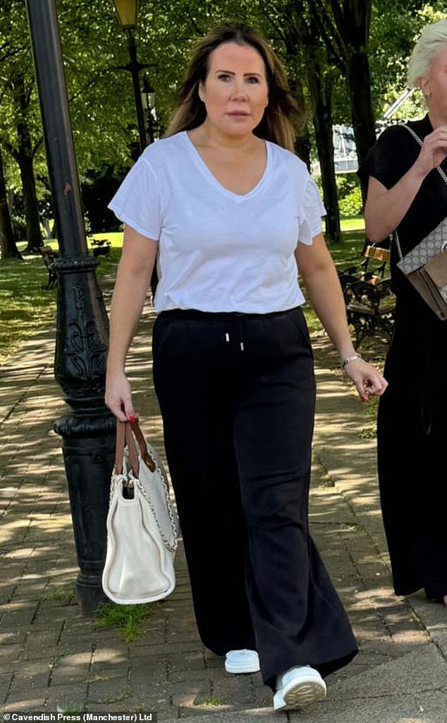 Jackson pictured outside Warrington Magistrates' Court. She was eventually reported to police and when officers arrested her they found a bag of mail at her home