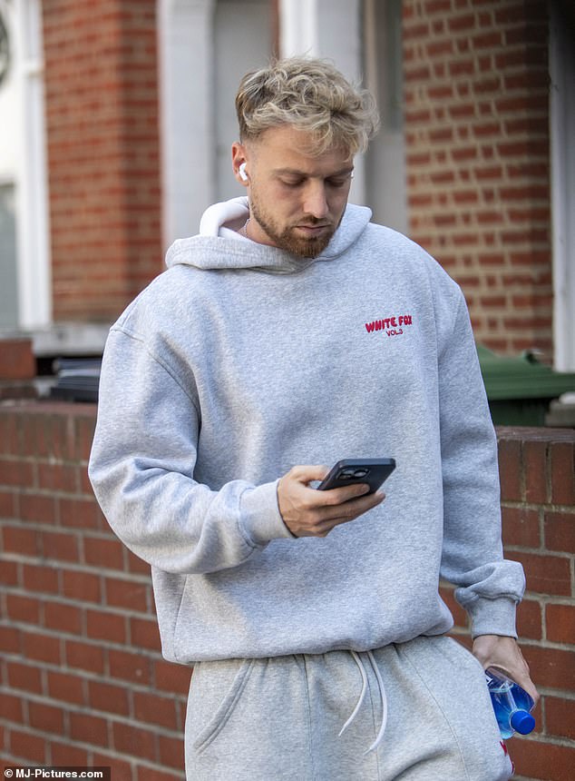 Coming out of his house to go to the gym on Monday, tracksuit-clad Sam couldn't smile and was busy checking his phone as he walked to his workout