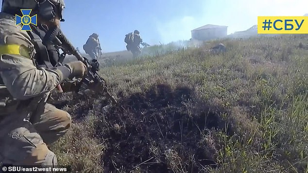 Headcam footage shows troops firing on enemy soldiers to liberate the remote but strategically important island, giving a major boost to Ukrainian resistance