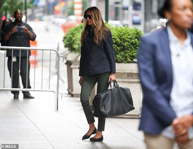 She was carrying a black Louis Vuitton bag