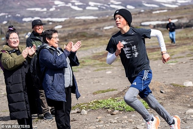 Locals cheered as Danish Prince Vincent ran the Family Mile in the Qeqertarsuaq Race during a visit to Qeqertarsuaq